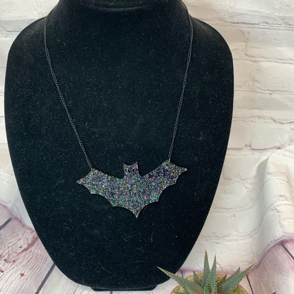 Necklace with acrylic bat.